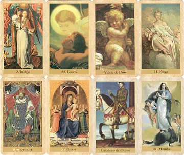 Cartas do Baralho dos Anjos com ilustra&ccedil;&otilde;es angelicais sobre uma mesa